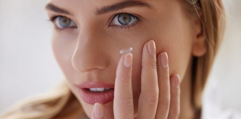 A women applying contact lens
