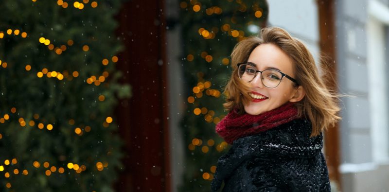 A smiling woman wearing glasses.