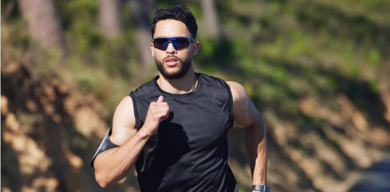 man running wearing sports sunglasses